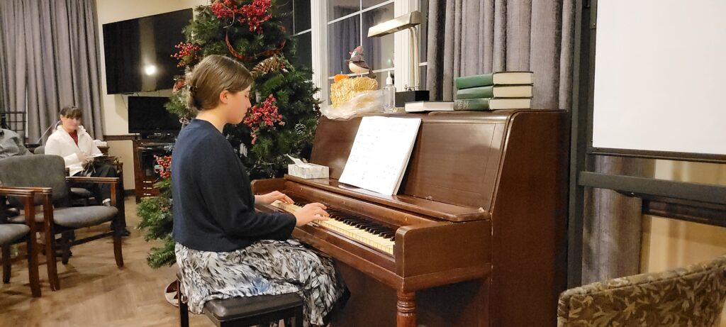 young girl playing the piano